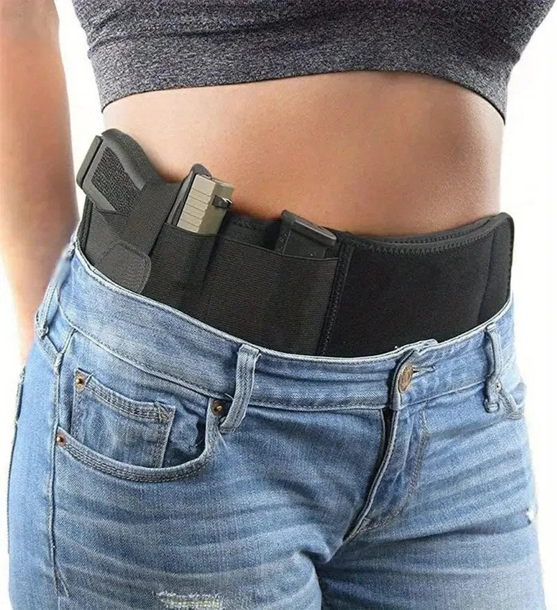 Belly band worn at appendix position over jeans with a pistol in the holster pocket