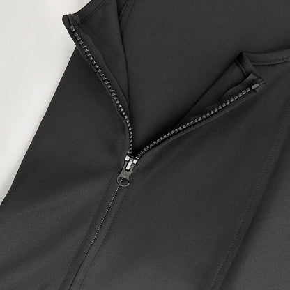 Close-up of the side zipper on the black vest