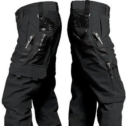 Black Phantom Tactical Pant, thigh pockets holding pens, a small flashlight and a multitool, D-rings at the waist